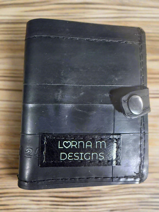 black wallet made from used inner tubes with a snap to keep it secure